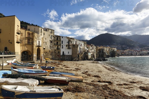 Traditional fishing boats on the shore, La Rocca mountain, Tyrrhenian Sea, Cefalu, Cefalù, Sicily, Italy