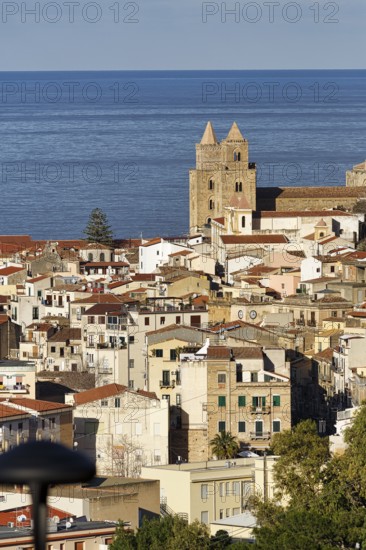 City view of Cefalù in winter, view over the rooftops of Santissimo Salvatore Cathedral, UNESCO World Heritage Site, and the Tyrrhenian Sea, medieval old town, Cefalu, Sicily, Italy