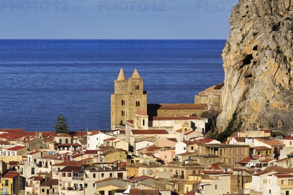 City view of Cefalù in winter, view over the rooftops of Santissimo Salvatore Cathedral, UNESCO World Heritage Site, and the Tyrrhenian Sea, medieval old town, Cefalu, Sicily, Italy