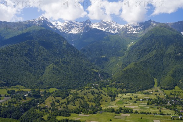 Extensive valley area with mountains in the background and small fields in the foreground, landscape near Mestia, Mingrelia and Upper Svaneti, Svaneti, High Caucasus, Georgia