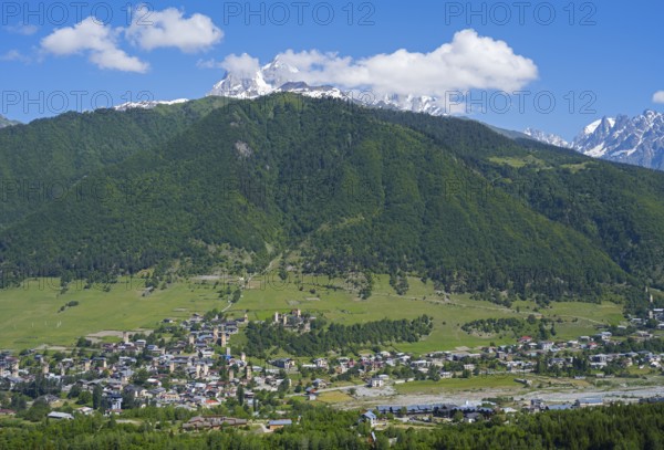 Village in an extensive, green hilly landscape with mountain scenery, Mestia, Mingrelia and Upper Svaneti, Svaneti, High Caucasus, Georgia