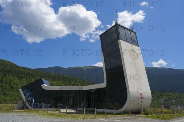 Modern building with futuristic design in front of a picturesque mountain landscape, airport building, Queen Tamar Airport, designed by Jürgen Mayer, Mestia, Mingrelia and Upper Svaneti, Svaneti, High Caucasus, Georgia