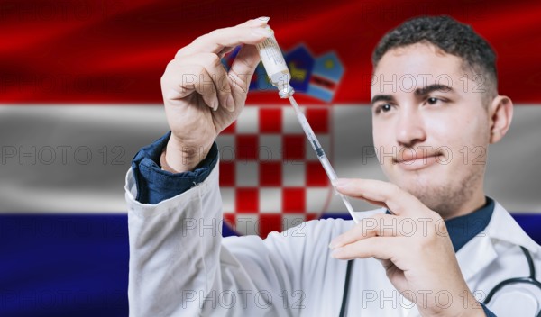 Doctor holding syringe on Croatia flag background. Medical professional holding syringe with Croatian flag in the background