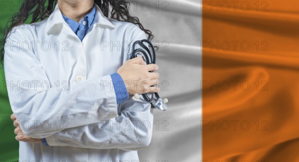 Healthcare professional with Ireland flag background. Professional doctor holding stethoscope on Ireland flag background