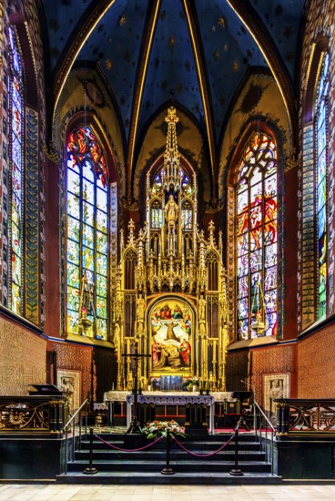 Wyspianski stained glass window and main altar in the presbytery, Franciscan Church, 1249, Krakow, Poland