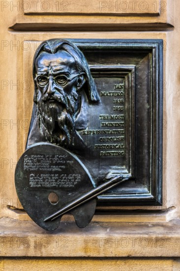 Memorial plaque for the famous Polish painter Matejko, details of the old town alleys, Krakow, Poland