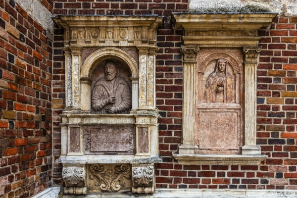 Stone epitaph at St Barbara's Church for the pharmacist and city councillor Jerzy Pipan (died 1566) and his first woman Anna Pipan (died 1541), Krakow, Poland