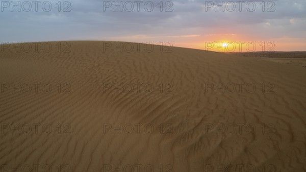 Sunset, sand dunes in the Wahiba Sands desert, Oman
