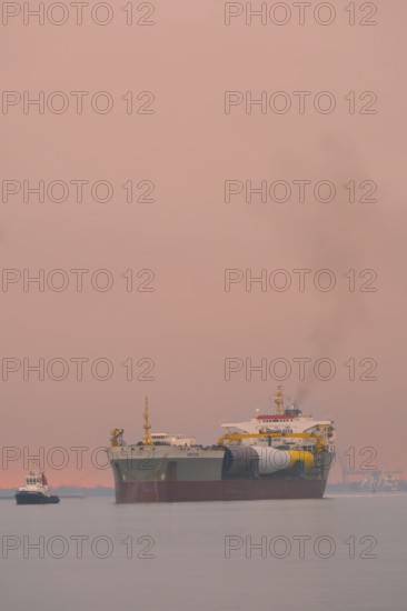 A semi-submersible ship is towed from the Weser to the North Sea, Bremerhaven, Bremen, Germany