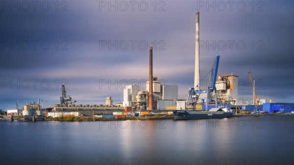 View across a harbor basin to the Kalihafen industrial area in Bremen, Germany