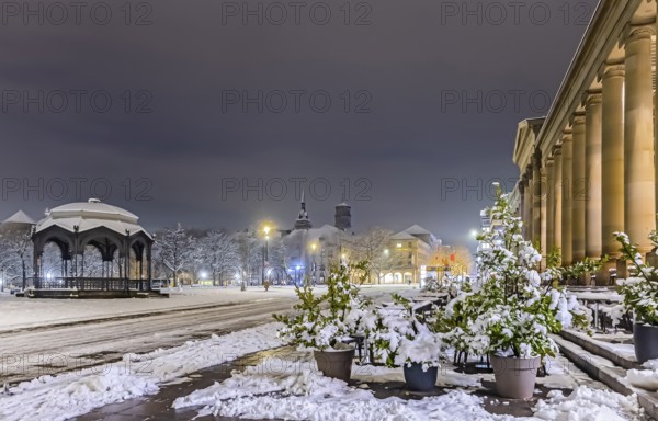 Winter in Stuttgart. It snowed overnight and the city is wintry white early in the morning. Palace Square with bandstand and royal building. Stuttgart, Baden-Württemberg, Germany