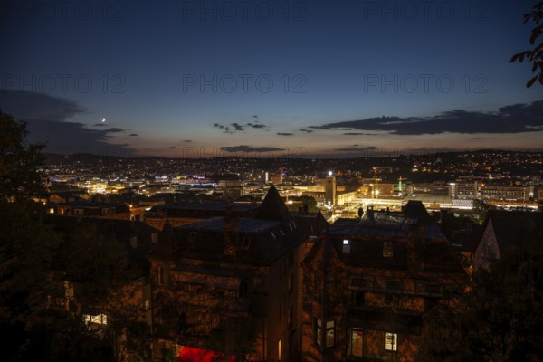 12 Sep 2018 at dusk, glowing city lights illuminate downtown with panoramic view. Stuttgart, Baden-Wurttemberg, Germany