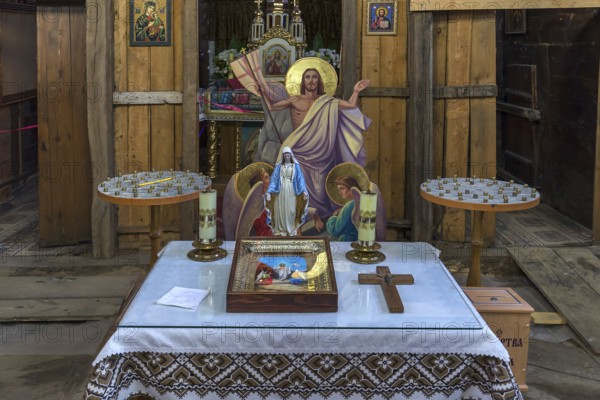 Prayer table in the historic wooden Trinity Church, Zhovkva city, Ukraine