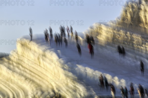 Terraced chalk cliffs Scala dei Turchi, anonymous walkers on Turkish steps, illustration, motion blur, Realmonte, Agrigento, Sicily, south coast, Mediterranean, Italy