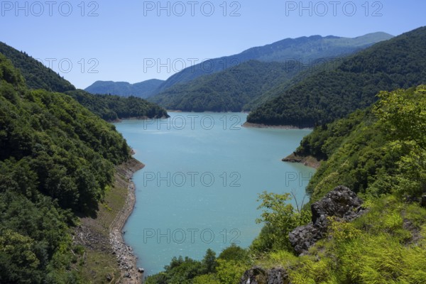 Clear mountain lake surrounded by wooded hills, Jvari Reservoir, Enguri River, Mingrelia and Upper Svaneti region, Georgia