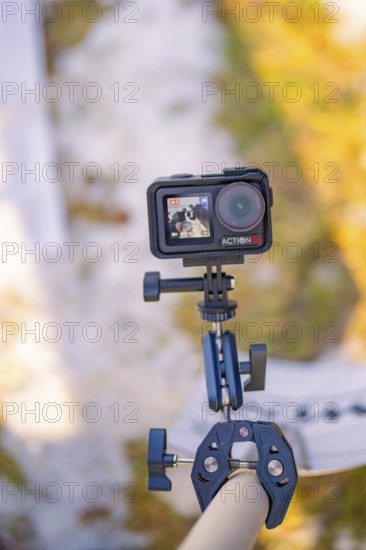 An action camera on a stand in a wintery outdoor environment, fiberglass groundbreaking, Freudenstadt, Germany