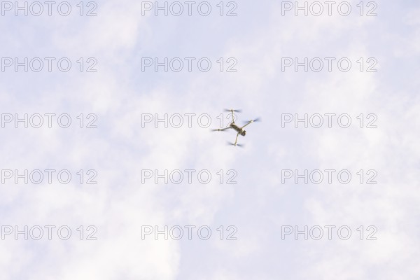 Drone in the sky with scattered clouds as it flies, fiberglass groundbreaking, Freudenstadt, Germany