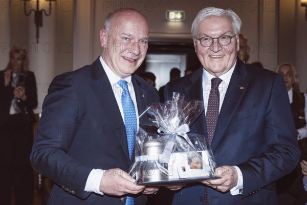 Kai Wegner and Frank-Walter Steinmeier with a gift in front of a dinner in honor of the Honorary Citizen of Berlin, Federal President Frank-Walter Steinmeier, given by Kai Wegner, Governing Mayor of Berlin, at Berlin's Red Town Hall on 28.01.2026