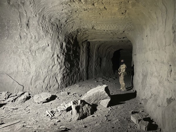 In Sarrin, Aleppo province, on January 27, 2026, footage captures an extensive subterranean network discovered following the withdrawal of Kurdish SDF fighters. The Syrian Army's clearing operations in the district near Ayn al-Arab revealed reinforced tunnels designed for vehicle transport, alongside abandoned military equipment and large quantities of unexploded ordnance, Aleppo, Ayn al-Arab, Syria