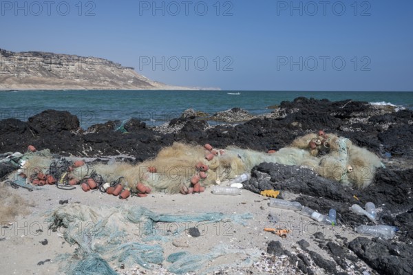 Garbage, fishing nets and plastic on the beach, Oman