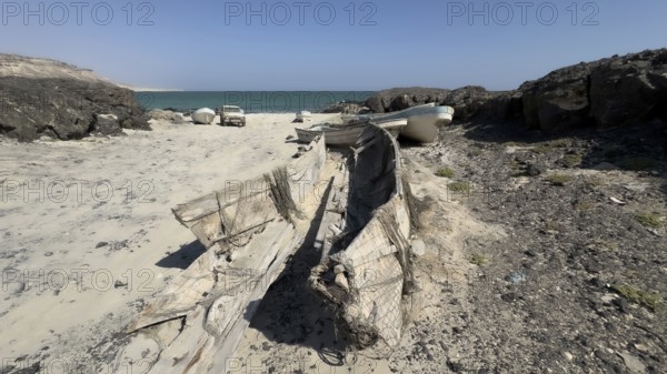 Old fishing boats, fishing village with boats on the beach, near Ras Madrakah, Oman