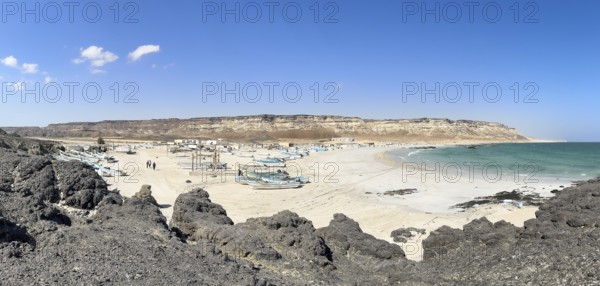 Fishing village with boats on the beach, near Ras Madrakah, Oman