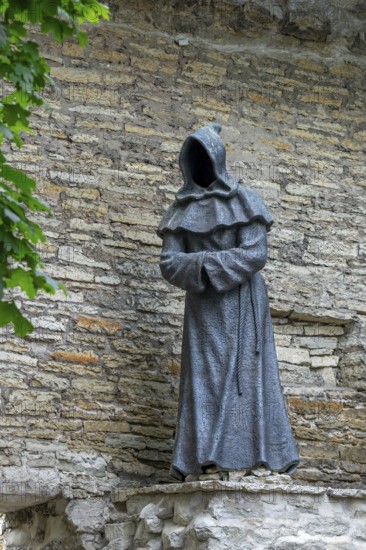 Monk sculpture, one of three bronze statues of faceless monks at the Danish King's Garden in the Old Town of the city Tallinn, Harju County, Estonia