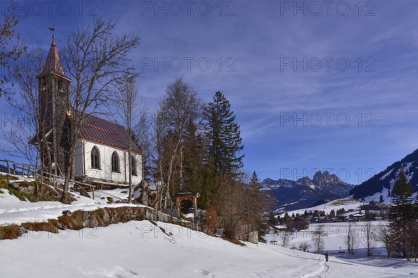 The Lourdes Chapel above Tannheim in the background the Rote Flüh, the Gimpel and the Köllnspitze, in the Tannheimer Valley in Tyrol in Austria