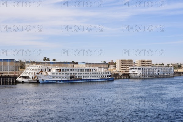 Nile cruise ships at a pier on the banks of the Nile, Egypt