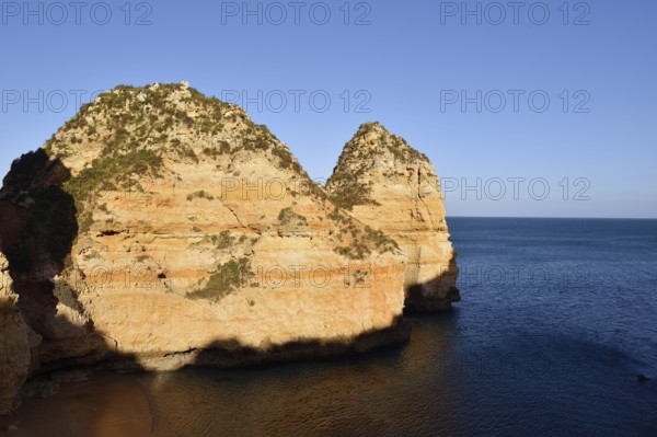 Rocky coast in evening light, Ponta da Piedade, Lagos, Algarve, Portugal