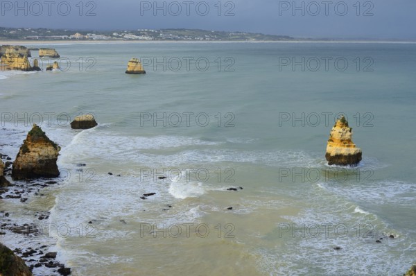 Rocky coast, rocks in the sea, Praia do Camilo, Lagos, Algarve, Portugal