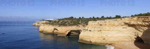 Rocky coast with caves, Praia da Corredoura, Algarve, Portugal