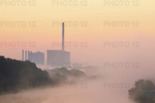 Datteln-Hamm Canal and Gersteinwerk power plant in morning fog at sunrise, Bergkamen, North Rhine-Westphalia, Germany