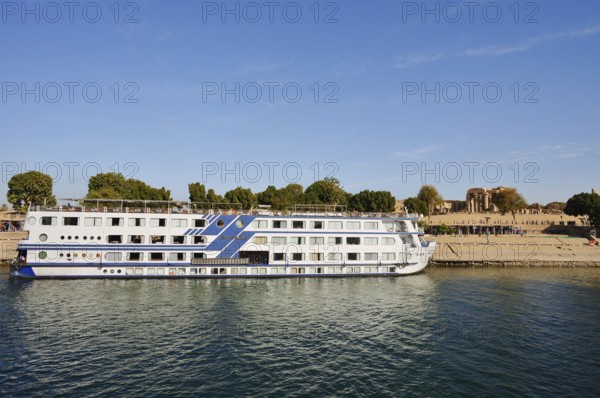 Nile cruise ship Radamis II at pier and double temple of Kom Ombo, Kom Ombo, Egypt