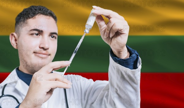 Doctor holding syringe on Lithuania flag background. Medical professional holding syringe with Lithuanian flag in the background