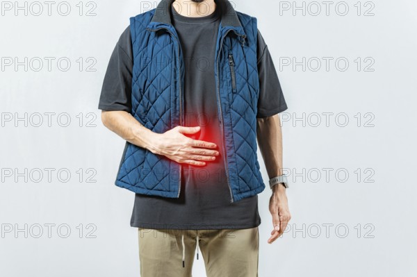 Person with digestive and stomach problems isolated. Unhappy man with digestive problems isolated