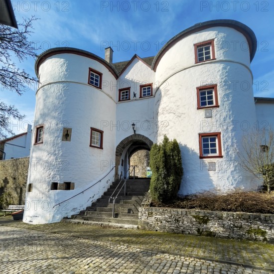 View of Osttor with staircase passage into preserved inhabited bailey of medieval hilltop castle Reifferscheid from Mittellat excursion destination in Eifel, Reifferscheid, Hellenthal, Euskirchen district, North Rhine-Westphalia, Germany