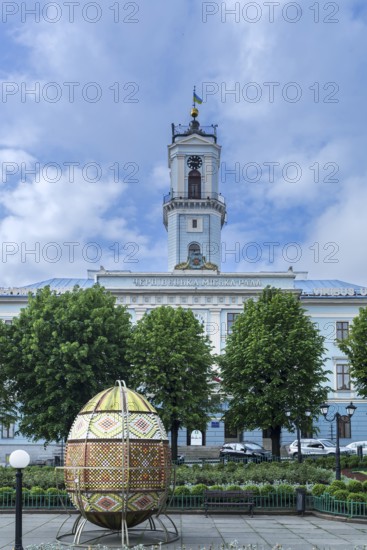 Traditional embroidered Easter egg, City Hall in the back, Chernivtsi, Ukraine