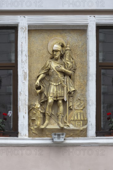 Gilded relief of St. Florian on a house wall, Czernowicz, Ukraine