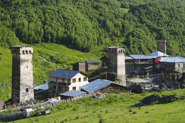 Medieval village with old towers and buildings, nestled in a green hilly landscape, defensive towers, Ushguli, Murqmeli district, Upper Svaneti, Svaneti, Georgia