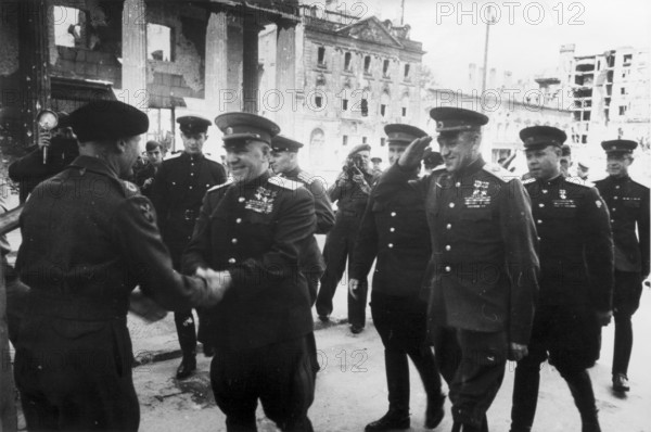 Montgomery, Commander-in-Chief of the British Armed Forces, greets Marshal Zhukov at the Brandenburg Gate, Berlin June 1945