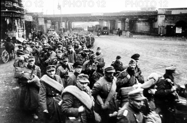 Under the York Bridges in Friedrichshain-Kreuzberg, German prisoners of war, early May 1945 J. Chaldej about this photo: I took many photos of prisoners of war in Berlin. It's very interesting how they reacted. They were ashamed of being prisoners in their own city. Here under the York Bridges, Berlin
