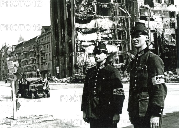 Two policemen, destroyed house, Berlin, Germany, June 1945