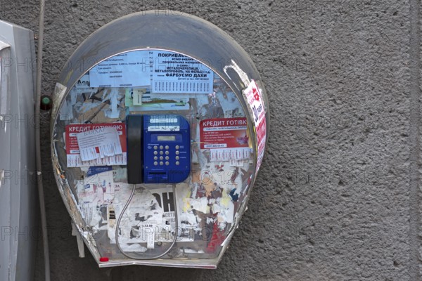 Public telephone on a house wall, Drochobych, Ukraine