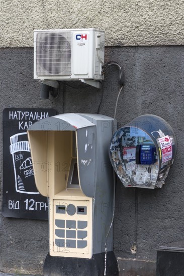 Public telephone on a house wall, Drochobych, Ukraine