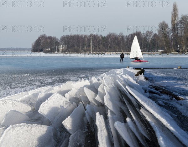 Eisfloes Steinhuder Meer winter with ice sailor and skater Steinhude Germany