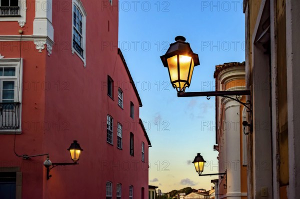 Facades of old houses illuminated by lanterns during sunset on the streets of Pelourinho in Salvador, Bahia, Pelourinho, Salvador, Bahia, Brasil