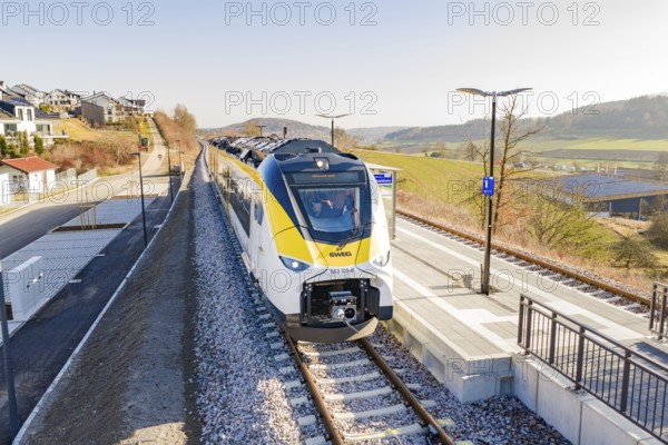 Modern train at the station, surrounded by rural architecture and extensive landscape, test run on the new Hermann Hesse railway with Siemens Mireo Plus B trains, Calw, Germany