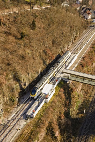Aerial view of a train near a bridge in a hilly landscape, test run on the new Hermann-Hesse railway with Siemens Mireo Plus B trains, Calw, Germany
