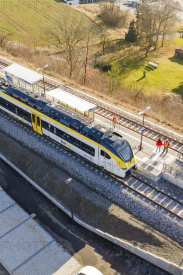 A train is standing on the platform, people on the track, surrounded by fields and countryside, test run on the new Hermann Hesse railway with Siemens Mireo Plus B trains, Calw, Germany